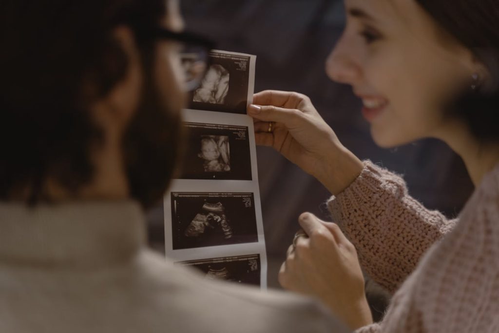 Parents looking at their baby’s ultrasound.